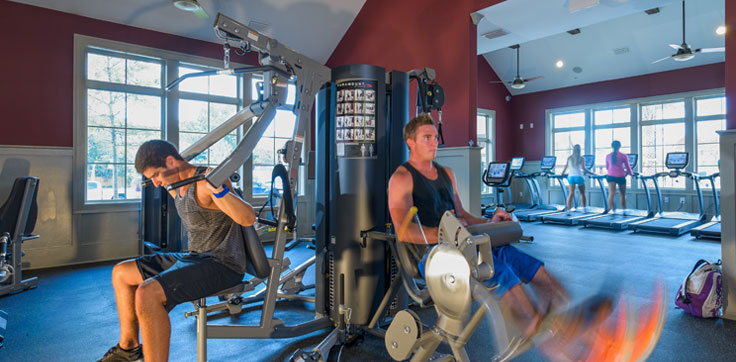 Fitness center with men working out