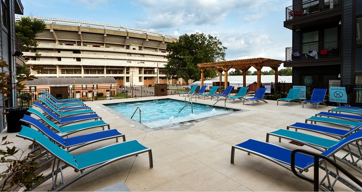 Tradition on The 50 resort style pool with view of stadium