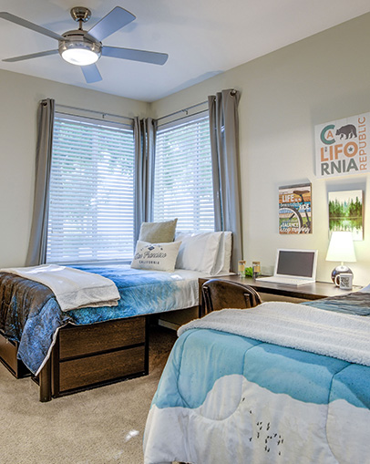 Bedroom featuring two large beds